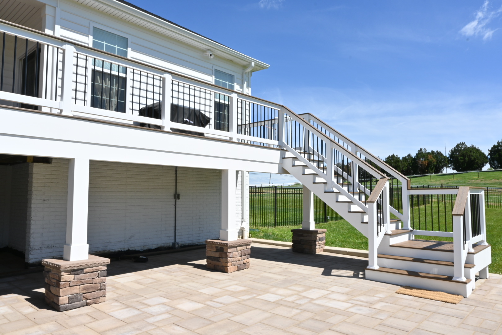 Multi-level backyard deck in McLean, Virginia by Precision Custom Woodwork & Remodeling